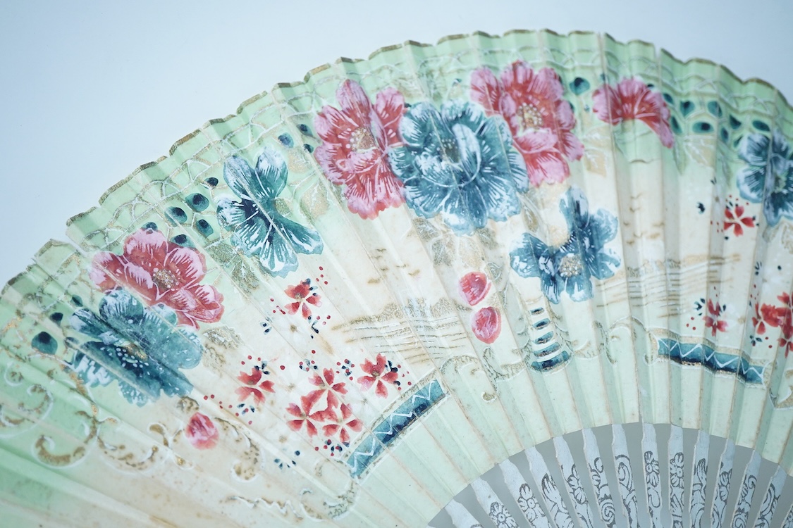 A collection of 19th century and later fans to include a black lacquered and lace example and a hand painted floral example